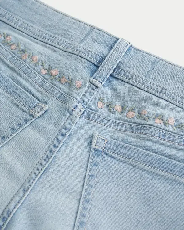 Curvy Low-Rise Light Wash Floral Embroidered Denim Shortie Shorts Curvy Low-Rise Light Wash Floral Embroidered Denim Shortie Shorts