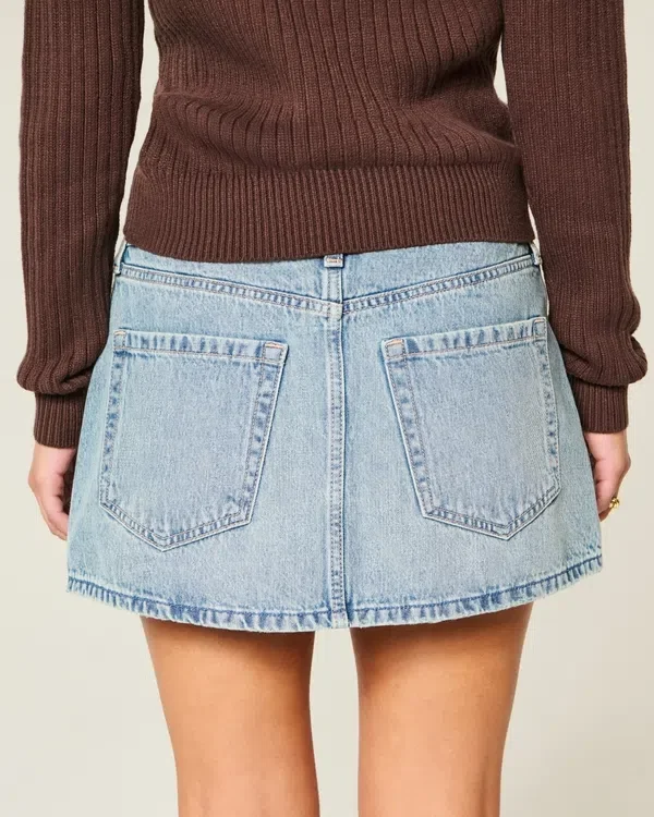 Low-Rise Medium Wash Studded Denim Mini Skort Low-Rise Medium Wash Studded Denim Mini Skort