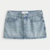 Low-Rise Medium Wash Studded Denim Mini Skort Low-Rise Medium Wash Studded Denim Mini Skort