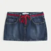 Low-Rise Waist Tie Denim Mini Skort Low-Rise Waist Tie Denim Mini Skort