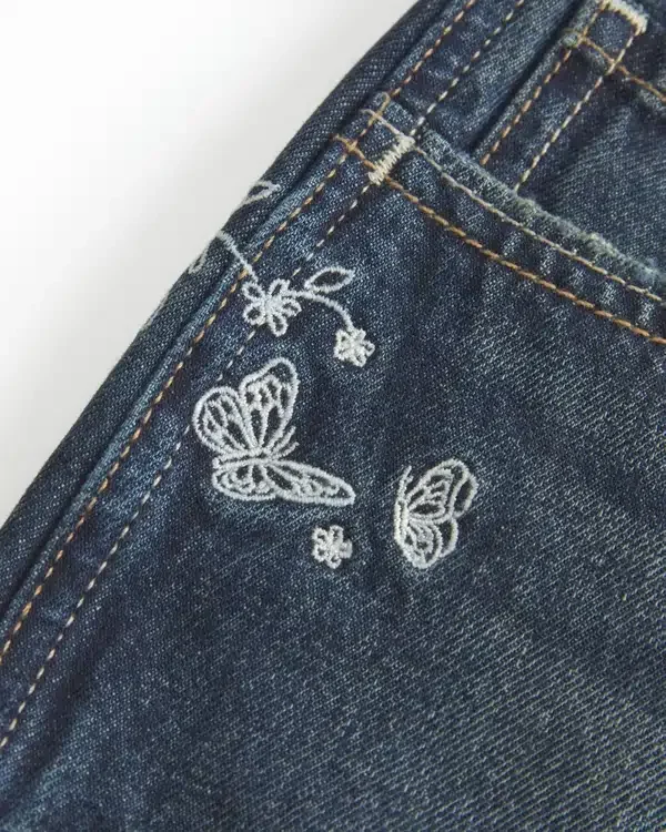 Ultra Low-Rise Dark Wash Butterfly Embroidered Denim Mini Shorts Ultra Low-Rise Dark Wash Butterfly Embroidered Denim Mini Shorts