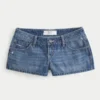 Ultra Low-Rise Distressed Medium Wash Denim Mini Shorts Ultra Low-Rise Distressed Medium Wash Denim Mini Shorts