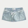 Ultra Low-Rise Light Wash Lace Tie Denim Mini Shorts Ultra Low-Rise Light Wash Lace Tie Denim Mini Shorts