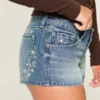 Ultra Low-Rise Medium Wash Floral Embroidered Denim Mini Shorts Ultra Low-Rise Medium Wash Floral Embroidered Denim Mini Shorts