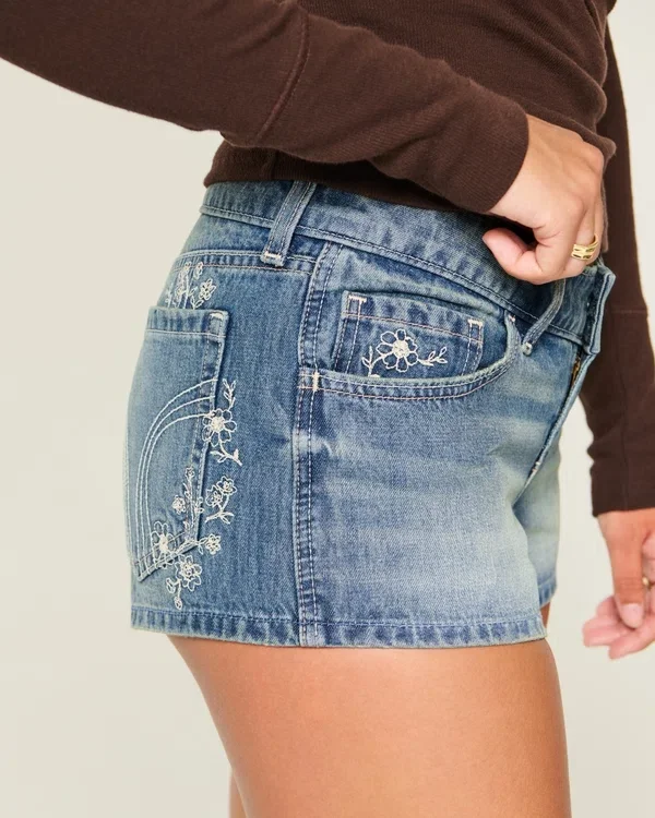 Ultra Low-Rise Medium Wash Floral Embroidered Denim Mini Shorts Ultra Low-Rise Medium Wash Floral Embroidered Denim Mini Shorts