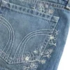 Ultra Low-Rise Medium Wash Floral Embroidered Denim Mini Shorts Ultra Low-Rise Medium Wash Floral Embroidered Denim Mini Shorts