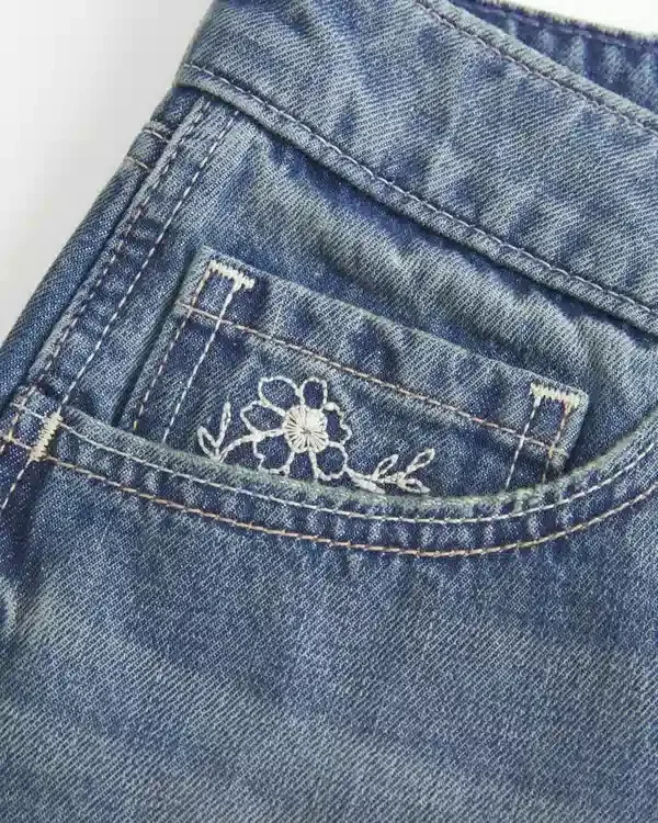 Ultra Low-Rise Medium Wash Floral Embroidered Denim Mini Shorts Ultra Low-Rise Medium Wash Floral Embroidered Denim Mini Shorts