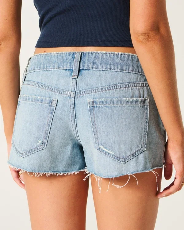 Ultra Low-Rise Ripped Medium Wash Mini Denim Shorts Ultra Low-Rise Ripped Medium Wash Mini Denim Shorts